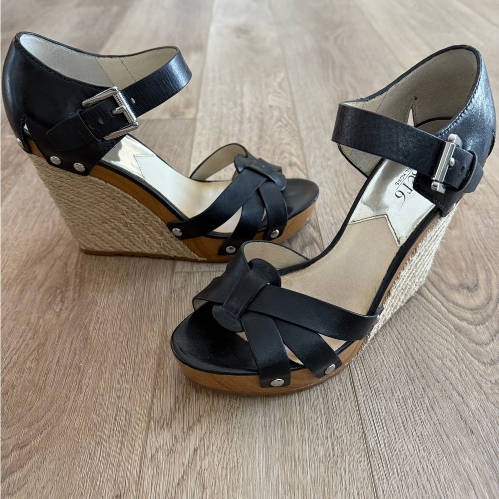 Michael Kors wedge black leather sandal.